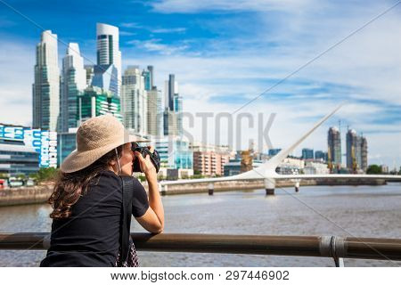 Buenos Aires Argentina - Dec 27, 2018:Beautiful young woman take a photos of  Puerto Madero district on suny day in Buenos Aires, Argentina.