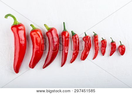 Heap Of Red Pepper On White Background. Top View,  Close-up. Ramiro And Chili Pepper. Food Concept.