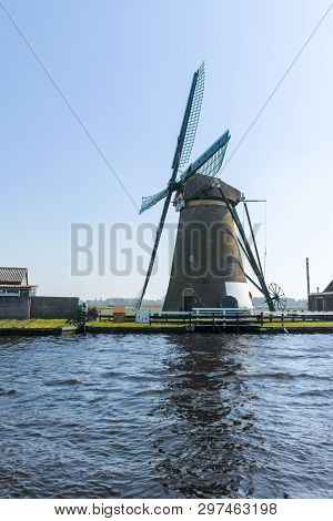 Waterways Of North Holland And View On Traditional Dutch Wind Mill, Spring Landscape