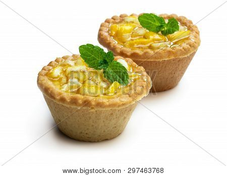 Egg Custard  Tarts With Jellied Lemon On Black Stone Background
