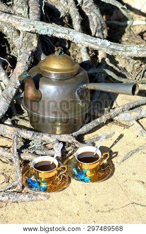 Serve Swedish Fika On The Beach With Two Shiny Cups And Candys.