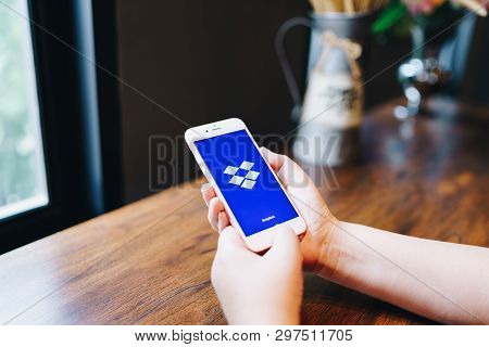 Chiang Mai, Thailand - Apr.08,2019: Woman Holding Apple Iphone 6s Rose Gold With Dropbox On Screen. 