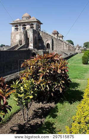 View Of Ship Palace Or Jahaz Mahal At Mandu With Garden Foliage In Foreground, Madhya Pradesh, India