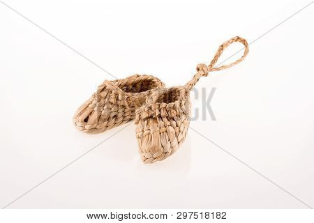 Pair Of Footware Made Of Straw On White Background