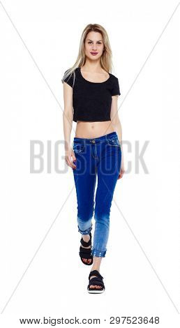 Front view of walking woman. beautiful girl in motion. frontside view of person. people collection. Isolated over white. A girl in a short T-shirt is smiling.