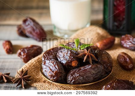 Ramadan Food And Drinks Concept. Ramadan Lantern With Milk, Dates Fruit And Green Mint Leaves In A B