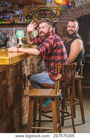 Friends Relaxing In Pub. Order Drinks At Bar Counter. Hipster Brutal Bearded Man Spend Leisure With 