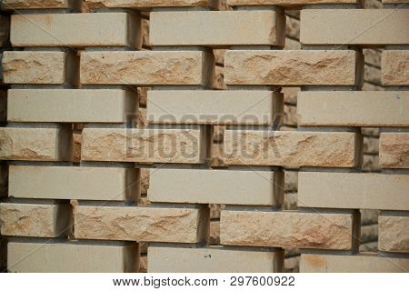 Sandstone Brick Wall Texture Background With Hole Between Briks