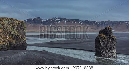 Reynisfjara, Cliffs Of Vik, Iceland - February 22, 2011: Reynisfjara Black Sand Beach And Reynisdran
