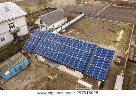 Aerial Top View Of New Modern Residential House Cottage With Blue Shiny Solar Photo Voltaic Panels S