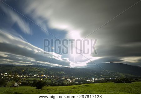 Summer Night Mountain Panorama. Green Grassy Mountain Clearing, Spruce Trees On Blue Evening Sky Cop
