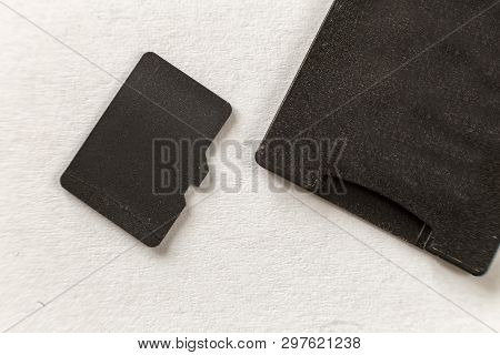 Close-up Of Micro Sd Memory Card And Sd Adapter Isolated On White Copy Space Background. Modern Tech