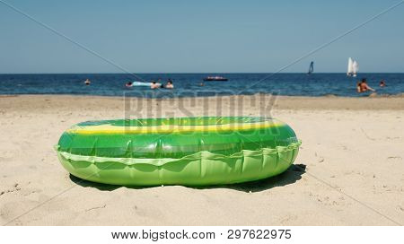 Green Rubber Ring For Swimming. Beautiful View Of The Baltic Sea. Beach And Stones. Königsberg