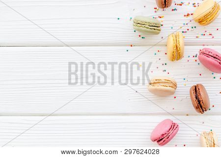 Brignt Macarons For Sweet Break On White Wooden Background Top View Mock Up