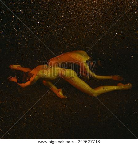 Sweer Dreams. Two Young Female Ballet Dancers Under Water Drops And Spray. Caucasian And Asian Model