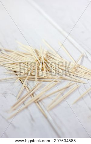 Bamboo Toothsticks On The White Table. Great Photo For Your Needs.