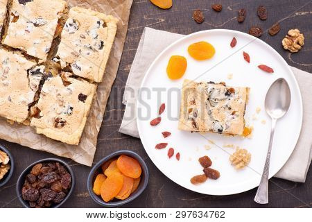 Traditional Polish Easter cake called Mazurek with plenty of dried fruits and nuts, top view