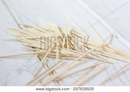 Bamboo Toothsticks On The White Table. Great Photo For Your Needs.