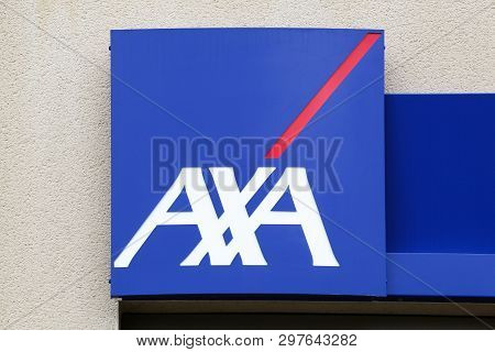 Peronnas, France - April 7, 2019: Axa Insurance Logo On A Wall. Axa Is A French Multinational Insura