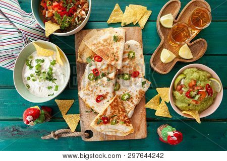 Delicious Homemade Quesadillas With Fresh Guacamole And Tomato Salsa