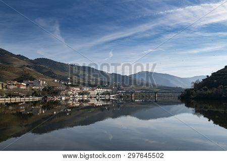 View Of The Pinhao Village With Terraced Vineyards And The Douro River, In Portugal; Concept For Tra