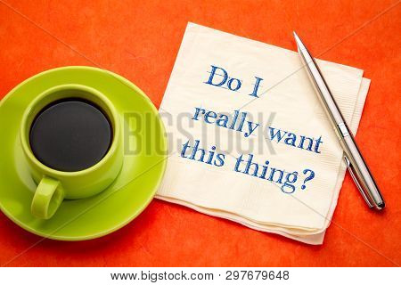Do you really want to do this? Handwriting on a napkin with a cup of coffee.