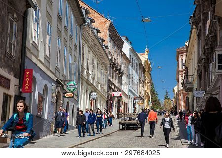 Zagreb, Croatia - April, 2018: Locals And Tourists Walking At A Beautiful Street With Antique Houses