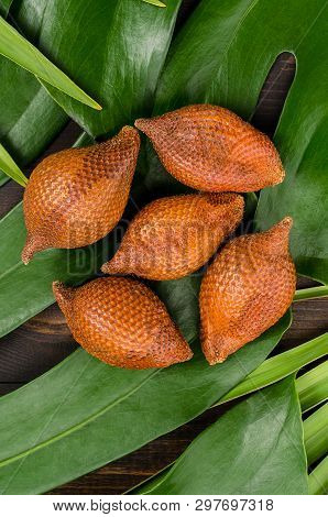 Snake Fruit, Rakum, Sala On Wood Background. Tropical Fruit.