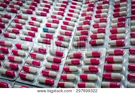 Outstanding Blue-white Capsule In Many Of Pink-white Antibiotic Capsule Pills In Blister Pack. Antib