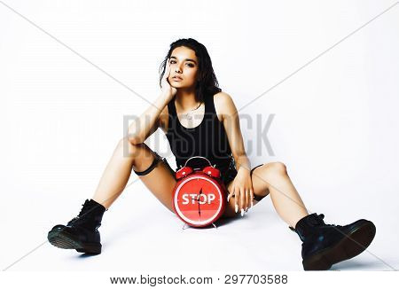 Young Pretty Indian Girl With Red Alarm Clock Posing Cheerful On White Background Isolated, Sexy Mod