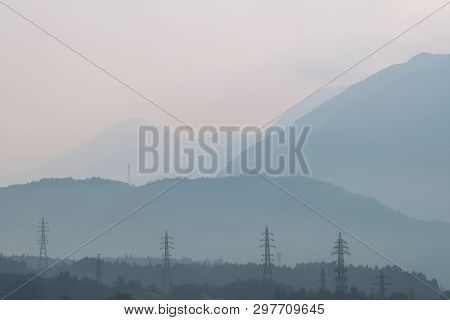 In Japan, The Morning And A Scenic Beautiful View Of Mountains Against The Sunlight, Electrical Pylo