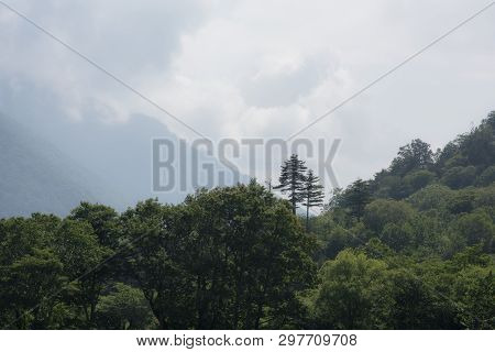 Scenic Landscape View Of Mountains And Cloudy Sky In Japan.