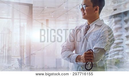Double Exposure Of Confident Woman Doctor Standing  And Modern Cityscape View On Background. Medical
