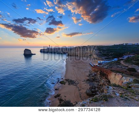 Sea Coast Sunset View With Lighthouse Of Ponta Do Altar. West View Over Praia Da Afurada Beach, Ferr