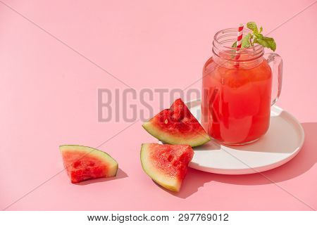Watermelin Jiuce On The Pink Background. Sliced Watermelon On The Wood Background