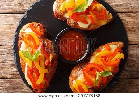 Delicious Cayenne Chicken Breast Baked With Cheese And Bell Peppers Closeup On A Board. Horizontal T