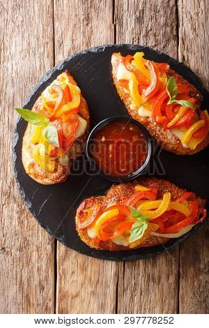 Cajun Chicken Baked With Cheese And Bell Peppers Close-up On A Serving Platter. Vertical Top View