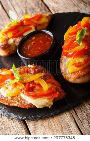 Cajun Chicken Baked With Cheese And Bell Peppers Close-up On A Serving Platter. Vertical