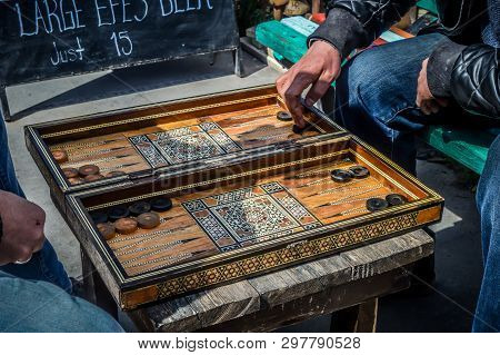 Turkish People Play Checkers Outdoors In Gerome Turkey