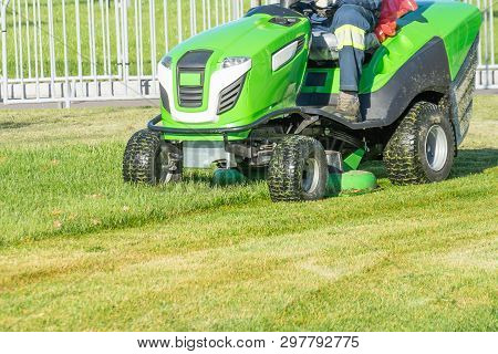 Ride Lawn Mower Mows A Green Fresh Grass