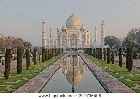 Agra, India - March 5 2018: Tourists Sighteseeing, Exploring And Admiring Famous The Taj Mahal