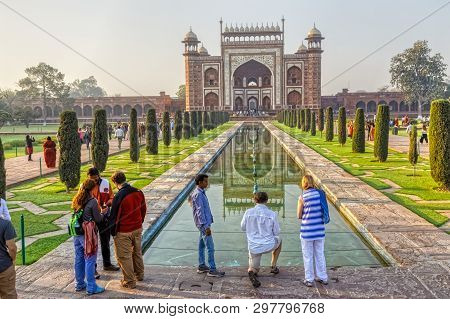 Agra, India - March 5 2018: Tourists Sighteseeing, Exploring And Admiring Famous The Taj Mahal