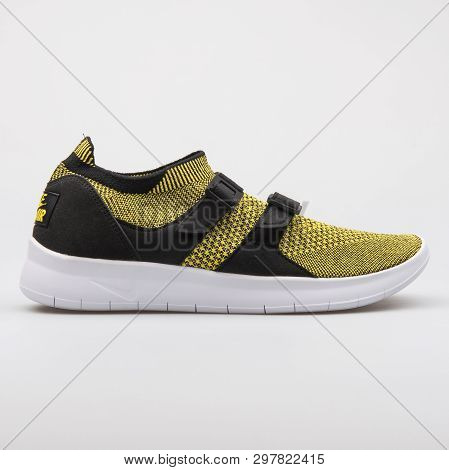 Vienna, Austria - August 7, 2017: Nike Air Sockracer Flyknit Yellow And Black Sneaker On White Backg