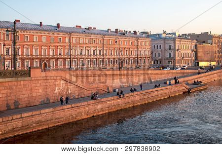 Saint - Petersburg, Russia - April 24, 2019: People Rest On The Kutuzov Embankment Along The Neva Ri