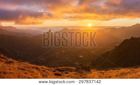 Sunset Over Gran Canaria, Spain. The Roque Nublo Is Visible On The Left Side. Tenerife Is Visible In