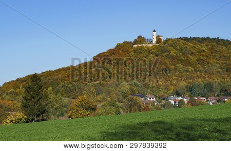 Castle Plesse In Lower Saxony, Germany. Surrounded By Woods In Their Autumn Colors And A Wonderful B