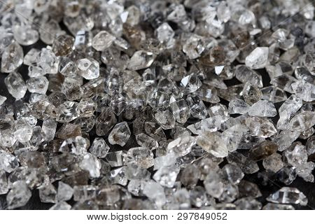 Scattered Diamonds On A Black Background. Raw Diamonds And Mining, A Scattering Of Natural Diamond S