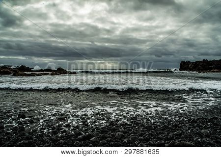 View From A Stony Shore To A Raging Ocean Waves During A Autumn Storm With A Horizon Line And Little