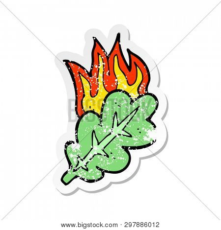 retro distressed sticker of a cartoon burning eaf symbol