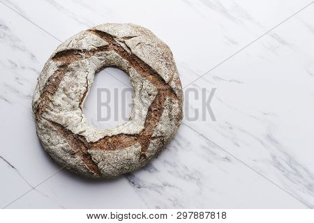 Rye Round Bread On Murble Background. Top View